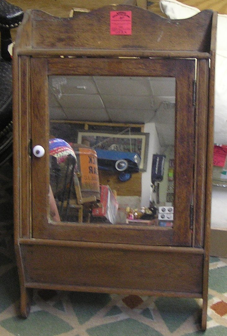Antique oak medicine cabinet: Antique oak medicine cabinet est. value $75.00-$100.00