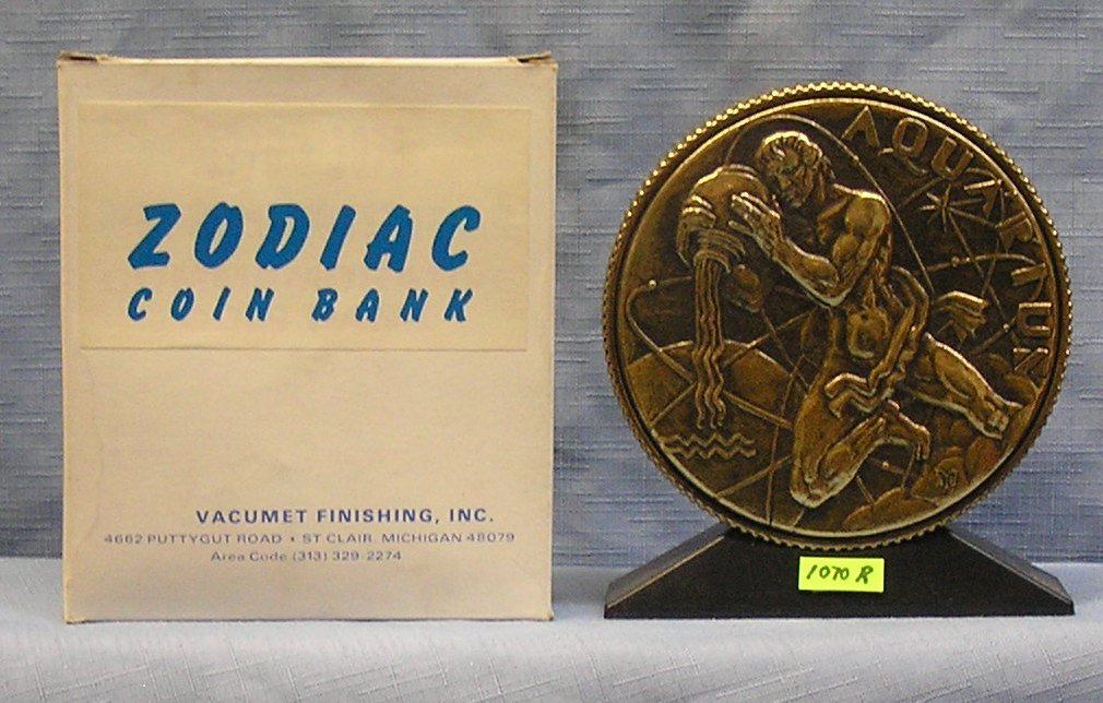 Vintage cast metal zodiac bank Aquarius: Vintage cast metal zodiac bank Aquarius with original box $65.00-$75.00