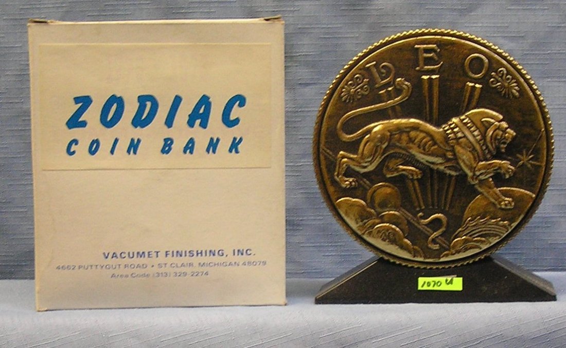 Vintage cast metal zodiac bank Leo: Vintage cast metal zodiac bank Leo with original box $65.00-$75.00