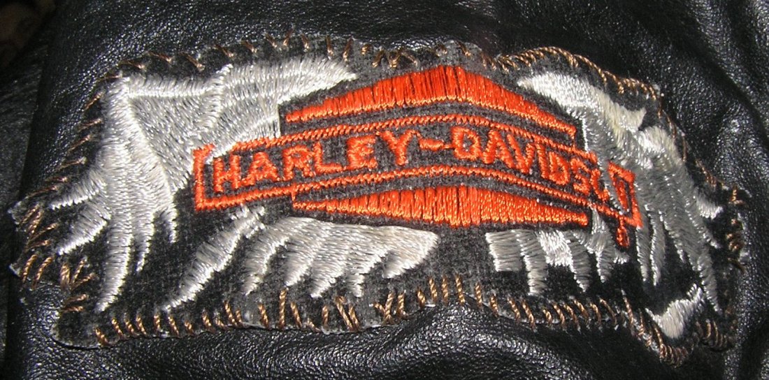 Vintage leather female biker jacket: Vintage leather female biker jacket with gypsey spirit titled art work on back and Harley Davidson patch on right arm size 7/8 Mfg by Marco Morani of Milano and NY est. value $100.00-$125.00