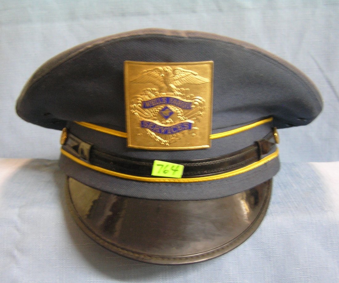 Vintage Wells Fargo armored car officers visor hat and: Vintage Wells Fargo armored car officers visor hat and badge est. value $100.00-$125.00