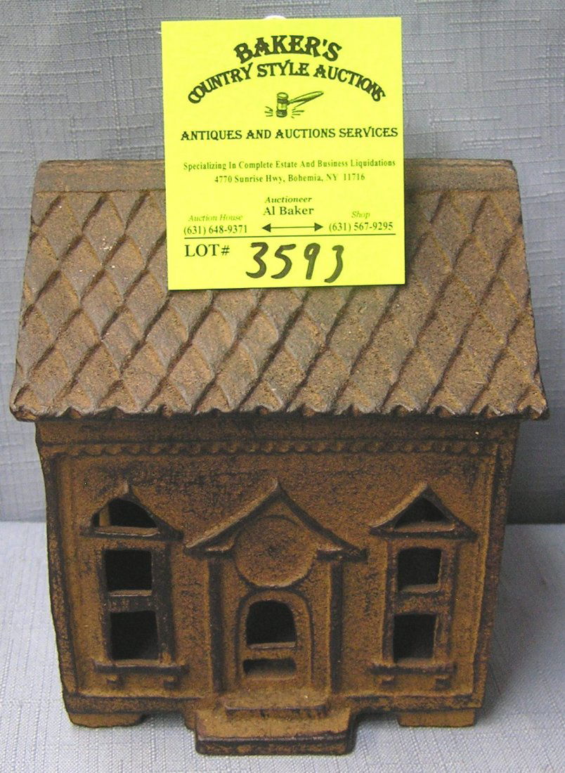 Cast iron building bank: Cast iron building bank est. value $50.00-$75.00