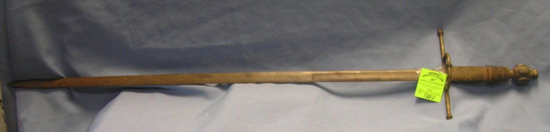 Large Medevel type sword: Large Medevel type sword solid brass handle with wrapped wire grip steel blade 43 1/2" est. value $375.00-$400.00