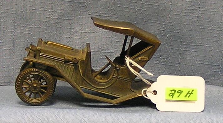 Vintage 1910 model T Ford cigarette lighter: Vintage all cast metal 1910 model T Ford promotional cigarette lighter, very good but missing rear wheel assembly est. value $50.00-$60.00