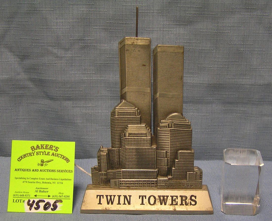 Pair of vintage Twin Towers of NYC collectibles: Pair of vintage Twin Towers of NYC collectibles includes pewter display piece and crystal paper weight $40.00-$50.00