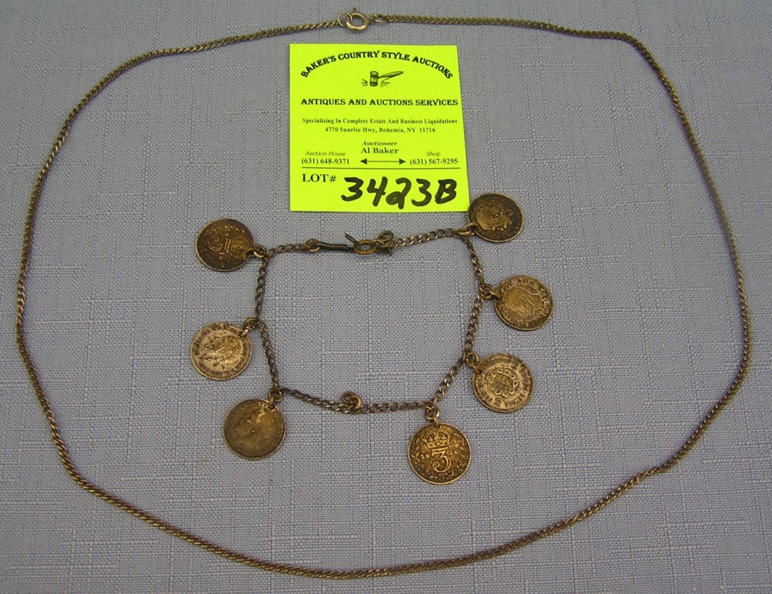 Sterling silver chain and coin bracelet: Sterling silver chain and coin bracelet just over 1/2 ounce est. value $25.00-$45.00