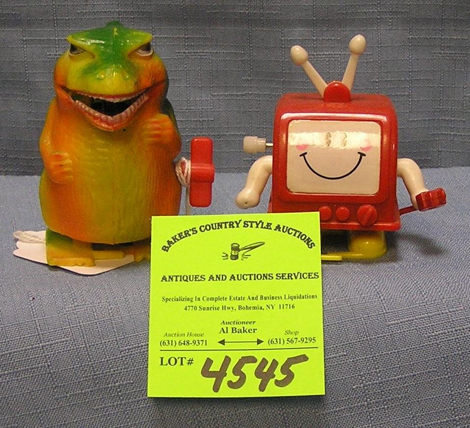 Pair of vintage wind up mechanical walking toys: Pair of vintage wind up mechanical walking toys includes Godzilla $30.00-$40.00