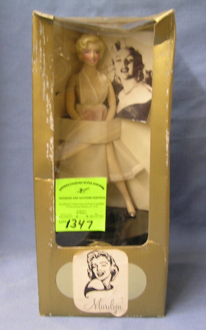 Vintage battery operated mechanical Marilyn Monroe: Vintage battery operated mechanical Marilyn Monroe Figural bank coin activated makes her dress blow up mint in original box est. value $125.00-$150.00