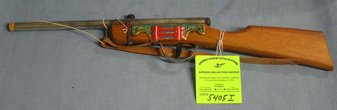 Early tin and wood cork pop gun new old stock never: Early tin and wood cork pop gun new old stock never played with $35.00-$45.00