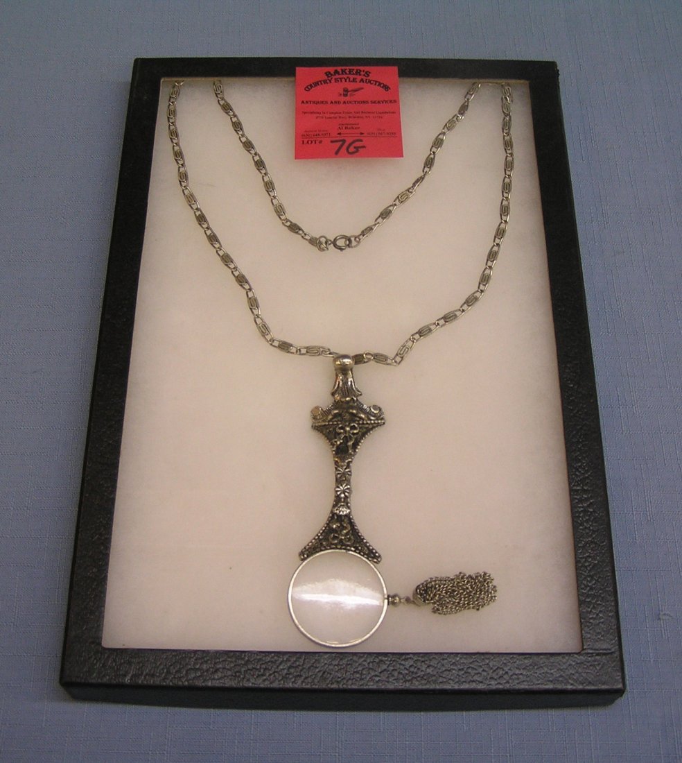High quality magnifying loop with hanging tassels: High quality magnifying loop with hanging tassels est. value $40.00-$50.00