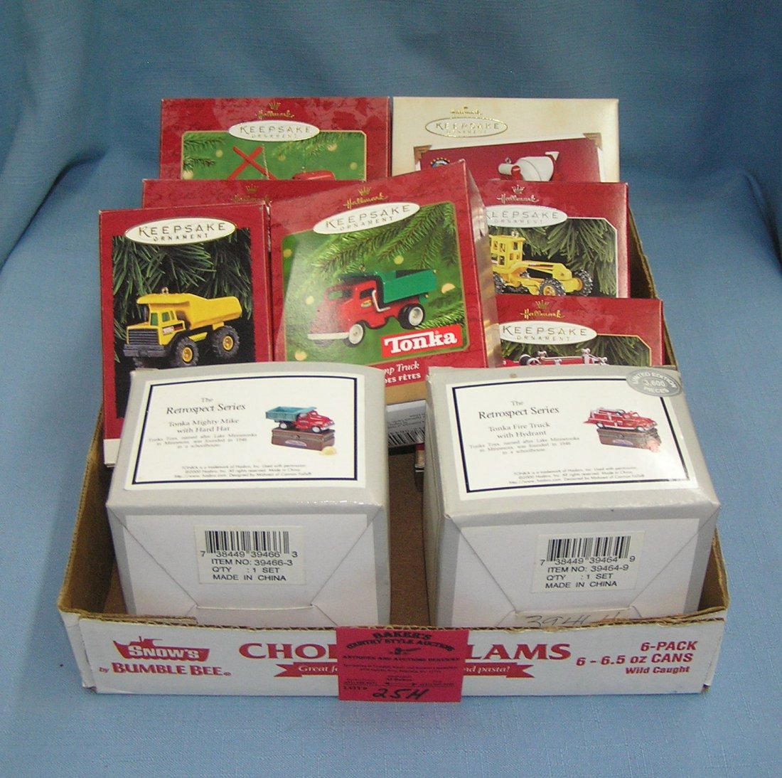 Box full of vintage Tonka Toys and collectibles: Box full of vintage Tonka Toys and collectibles includes Hallmark keepsakes est. value $50.00-$60.00