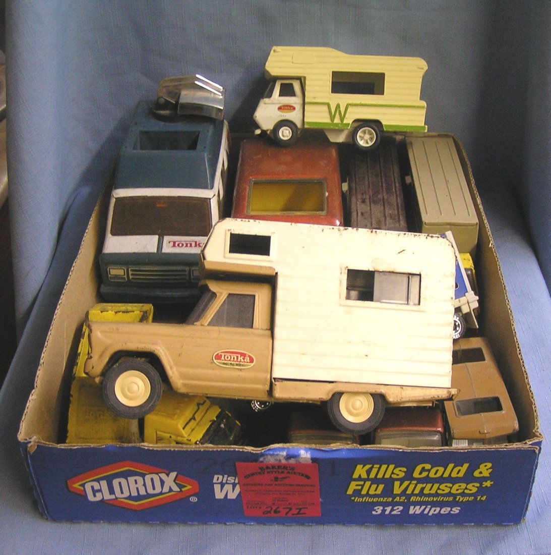 Box full of vintage Tonka toys and trucks: Box full of vintage Tonka toys and trucks includes campers est. value $75.00-$100.00