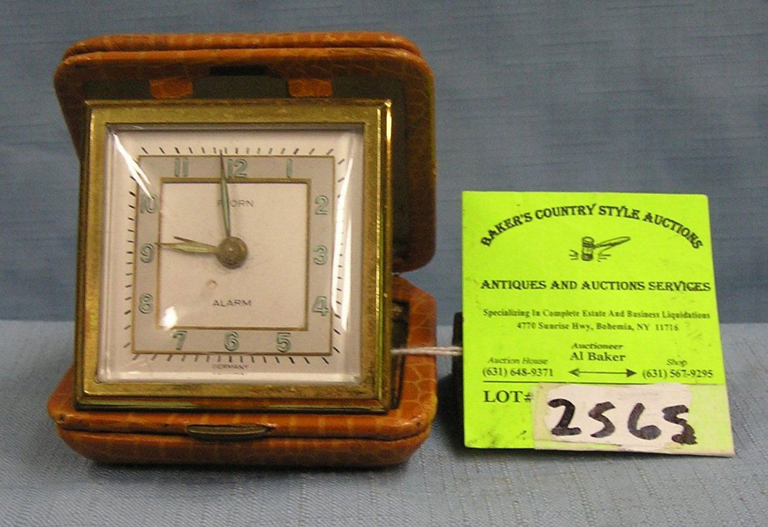 Vintage Folrn travel alarm clock with nice leather case: Vintage Folrn travel alarm clock with nice leather case est. value $35.00-$40.00