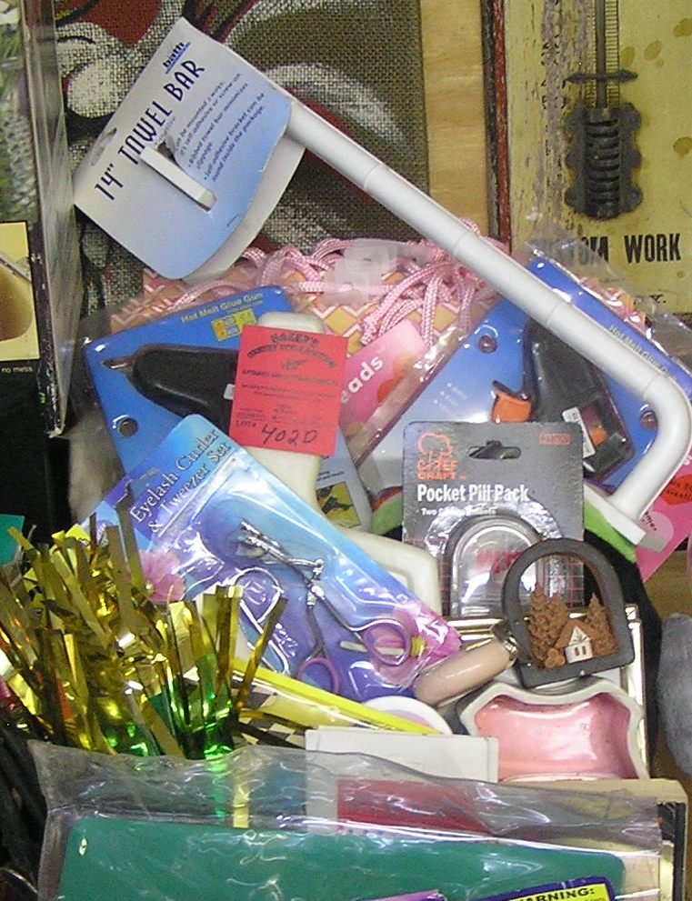 Large box full of new and like new store products: Large box full of new and like new store products including new glue gun, novelties, picture frames, collectibles and more est. value $40.00-$50.00