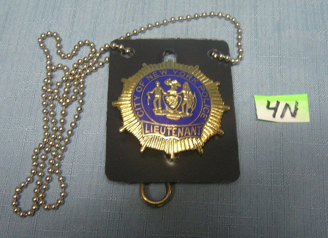 NY City police lieutenant badge: Vintage NY City police lieutenant gold toned and blue enameled badge est. value $90.00-$100.00