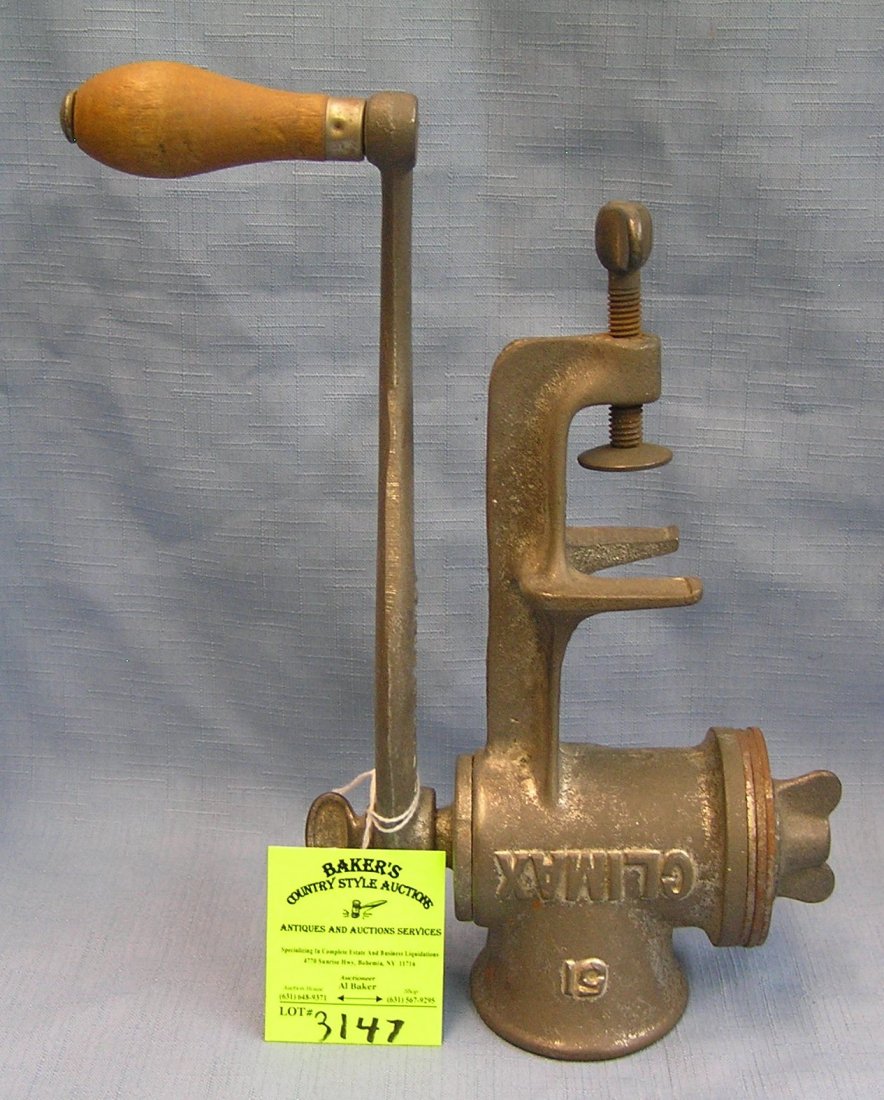 Antique cast iron meat grinder by Climax Co.: Antique cast iron meat grinder by Climax Company est. value $40.00-$50.00