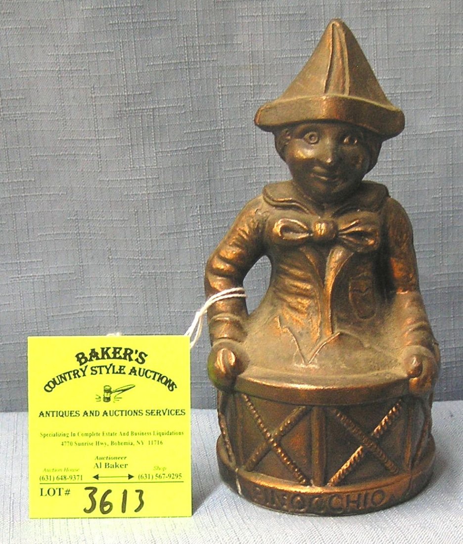 Vintage cast metal Pinocchio bank: Vintage cast metal Pinocchio bank est. value $50.00-$75.00