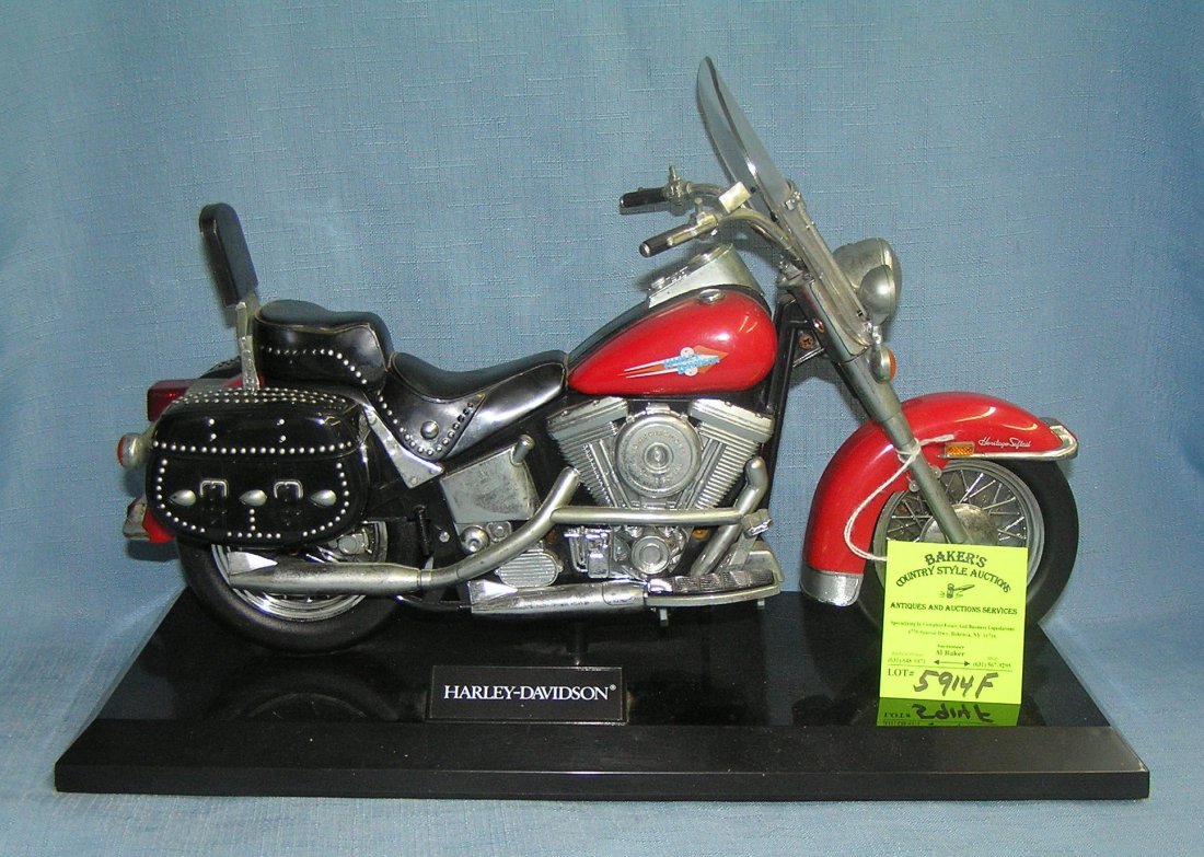 Harley Davidson Heritage soft tail motorcycle novelty: Quality Harley Davidson Heritage soft tail motorcycle novelty telephone, official licensed product on base 6 1/2" wide by 15" long with the official licensed logo est. value $75.00-$80.00