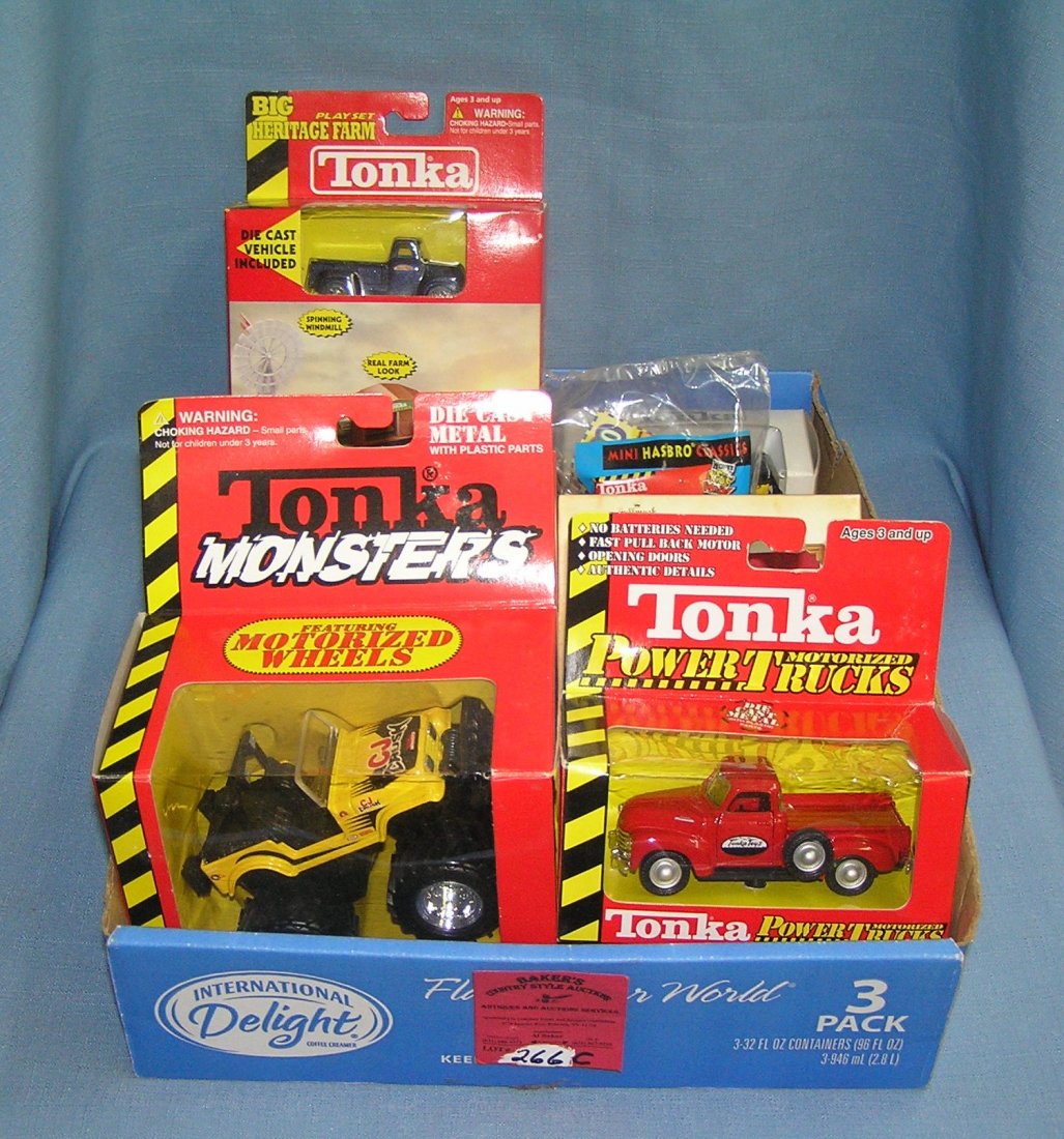 Box full of vintage Tonka toys and collectibles: Box full of vintage Tonka toys and collectibles, mint in box est. value $40.00-$50.00