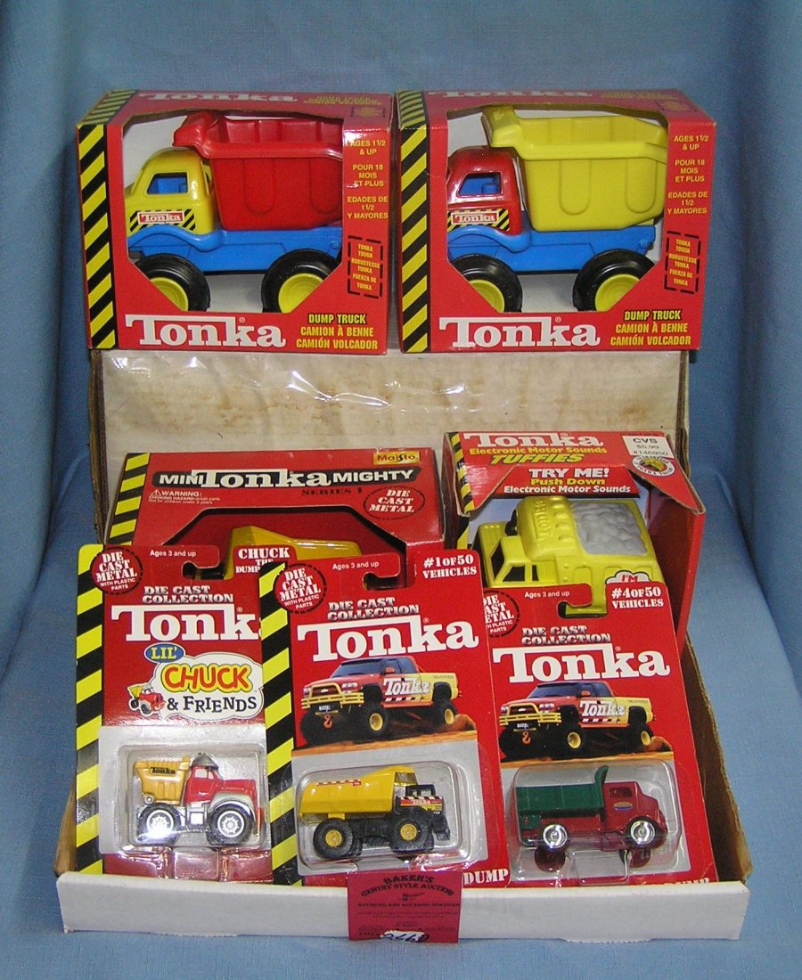 Box full of vintage Tonka toys and collectibles: Box full of vintage Tonka toys and collectibles, mint in box est. value $40.00-$50.00