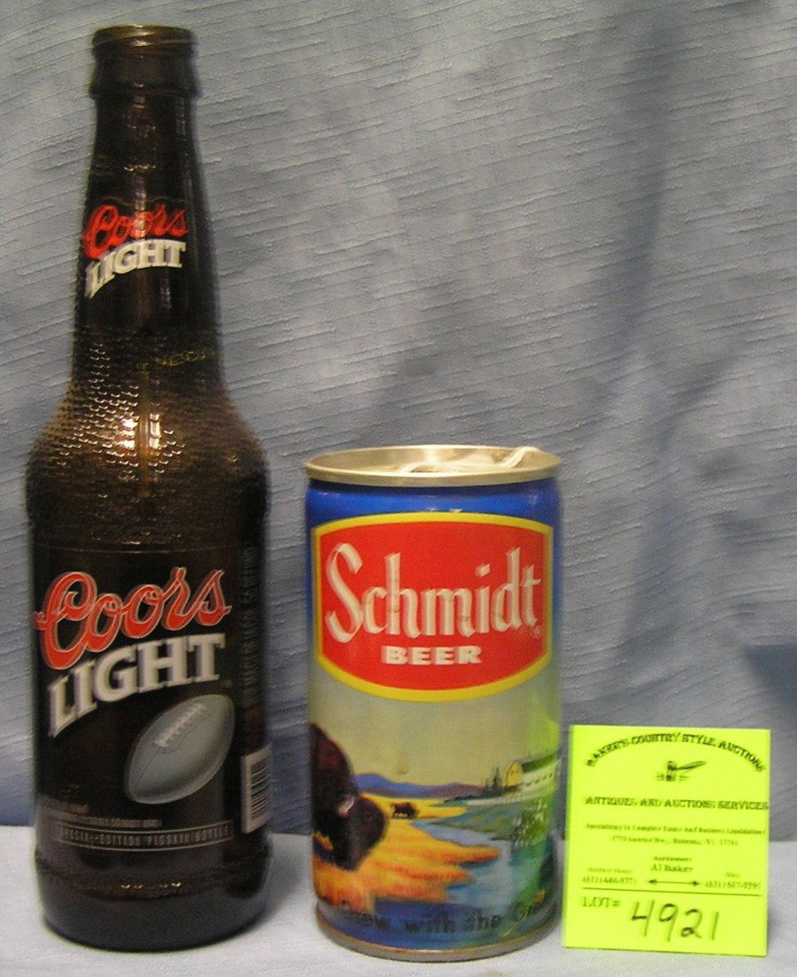 Pair of vintage beer collectibles: Pair of vintage beer collectibles includes early Schmidt’s beer can and Coors Light football themed bottle $25.00-$35.00