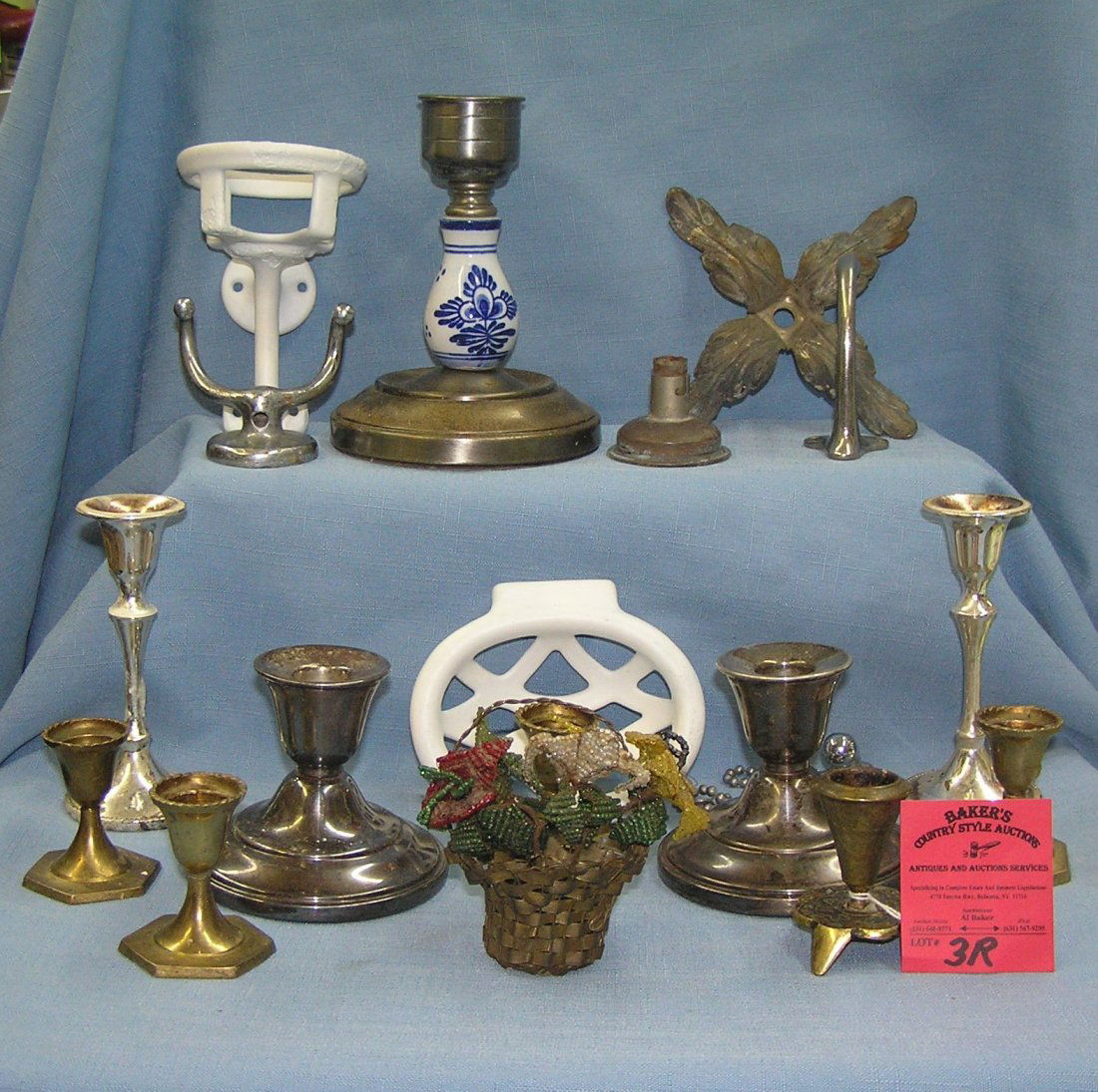 Group of vintage candle holders and more: Group of vintage brass candle holders and an early basket with hand made bead work flowers, Group of silver plated and brass candle sticks one with blue porcelain decoration, Box of antique brass and