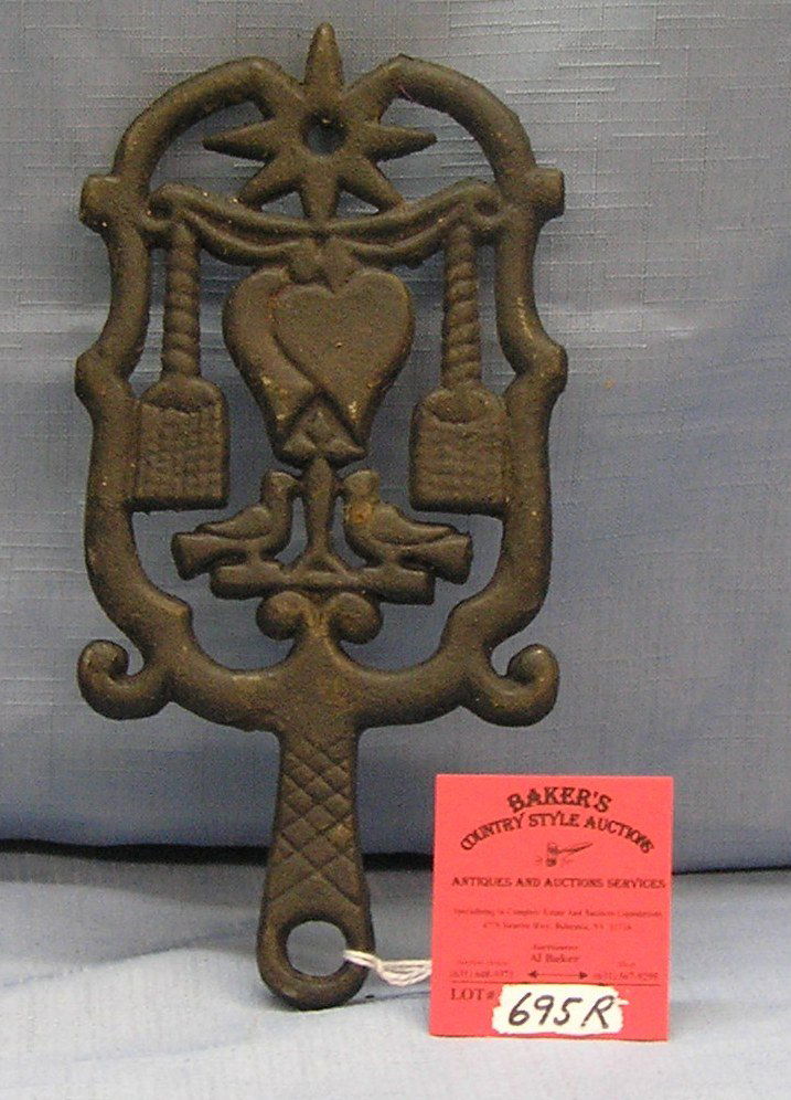 Vintage cast iron trivet dated 1951: Vintage cast iron trivet dated 1951 est. value $30.00-$35.00