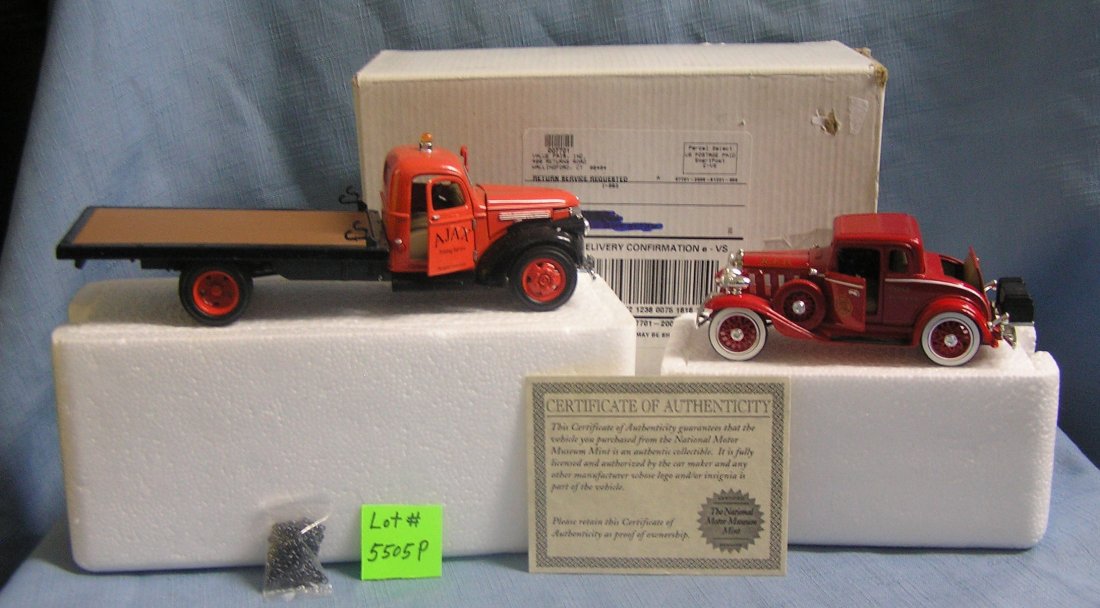 Pair of die cast and plastic toy vehicles: Pair of die cast and plastic toy vehicles includes an Ajax flat bed tow truck and a fire chief coupe, mint in original box with certificate est. value $50.00-$60.00