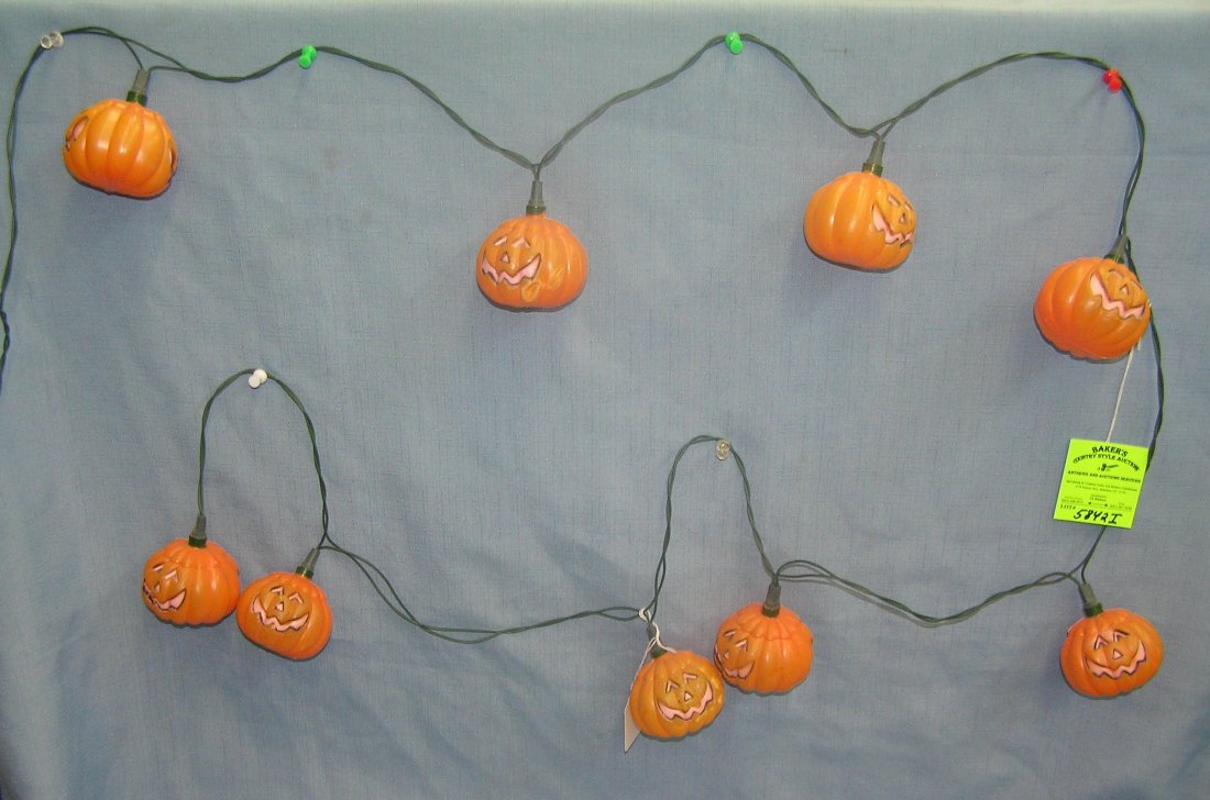 Jack O' Lantern Halloween lights: Set of vintage Jack O' Lantern themed electric illuminated hanging Halloween lights featuring 9 decorative Jack O' Lanterns est. value $35.00-$40.00