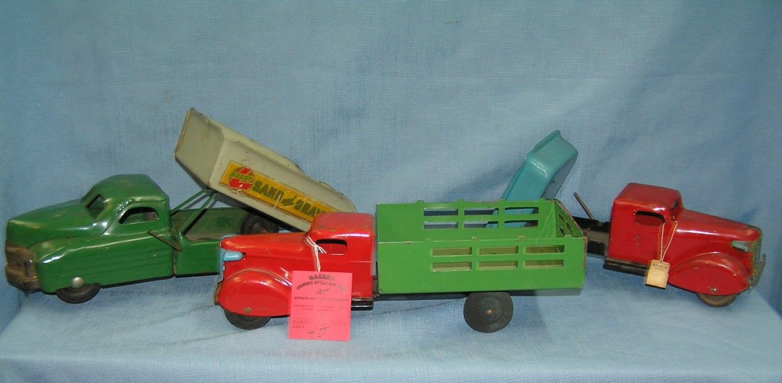 Group of 3 great early pressed steel toy trucks: Group of 3 great early pressed steel toy trucks one with original store tag including Buddy L and Wyandotte est. value $450.00-$550.00