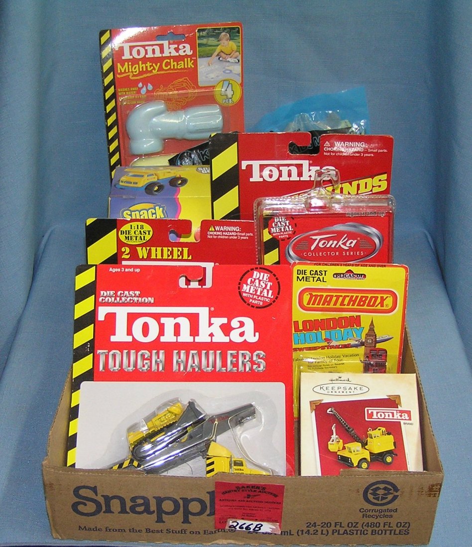 Box full of vintage Tonka toys and collectibles: Box full of vintage Tonka toys and collectibles est. value $40.00-$50.00