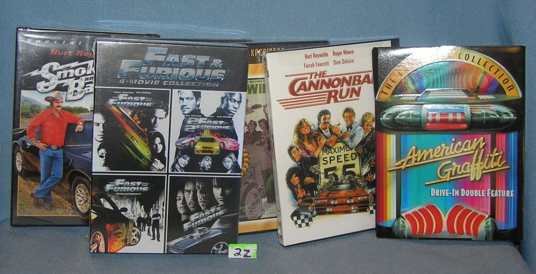 Group of 9 new automotive themed DVD movies: Group of 9 new automotive themed DVD movies includes Wild Ride, Hot Rods to Hell, Smokey and the Bandit, Cannonball Run, American Graffiti and Fast and Furious 4 movie collection est. value $100.00-$1