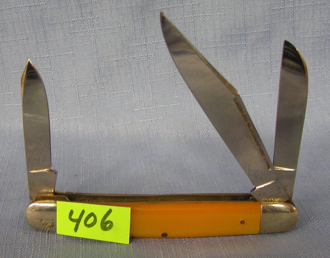 Vintage bone style three bladed pocket knife: Vintage bone style three bladed pocket knife by Regent yellow Lucite handle circa 1950’s mint dealer store stock est. value $50.00-$65.00