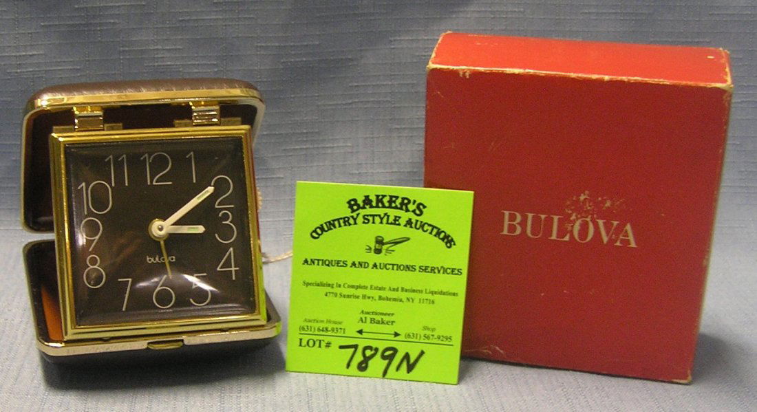 Vintage Bulova travel alarm clock: Vintage Bulova travel alarm clock with brass and leather, with original box and instruction booklet est. value $40.00-$50.00