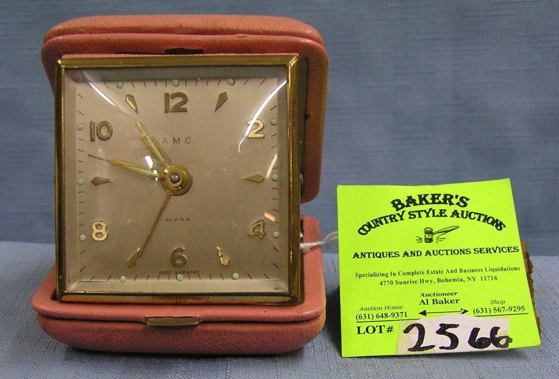 Vintage AMC travel alarm clock: Vintage AMC travel alarm clock made in Western Germany est. value $35.00-$40.00