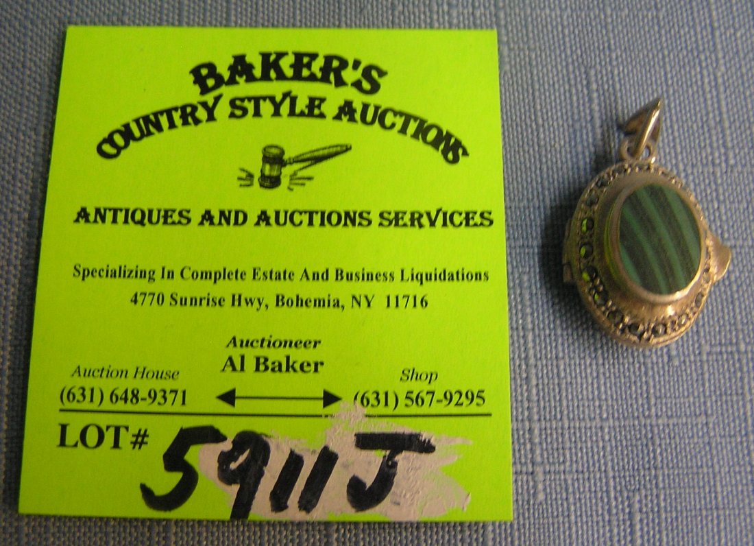 Sterling silver locket: Sterling silver locket with markasite and green tourquoise stone est. value $40.00-$50.00