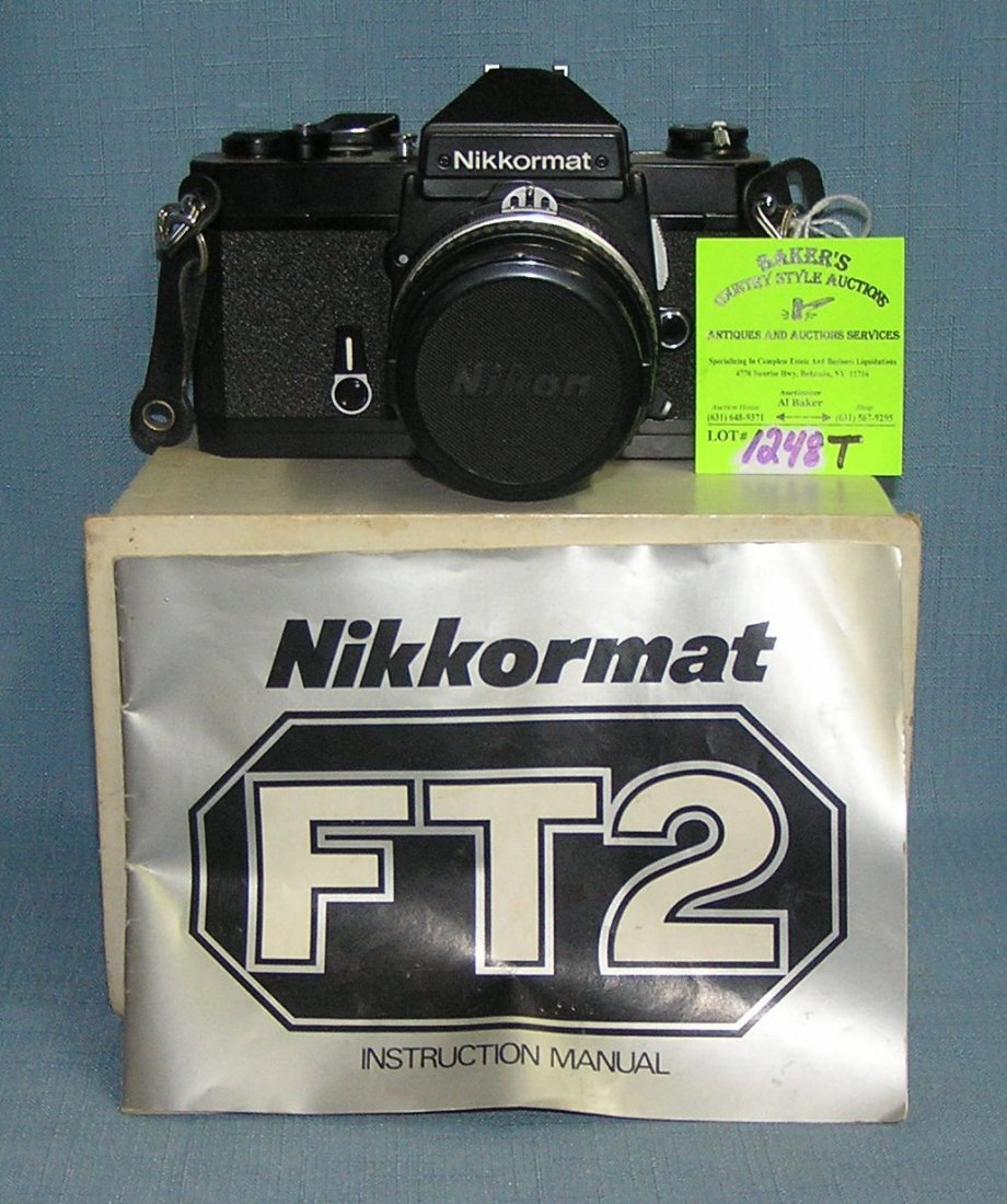 Nikon 35 MM camera with 50MM lens: Nikon 35 MM camera with 50MM lens est value $150.00-$175.00