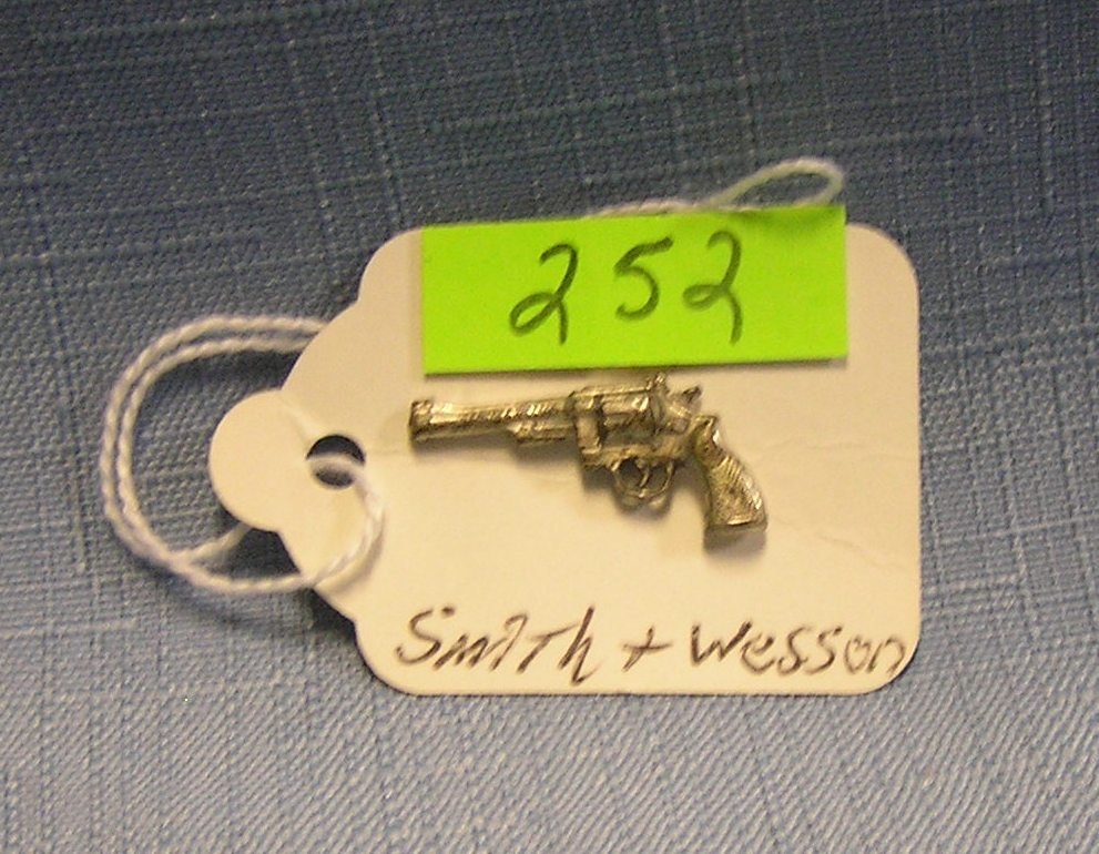 Early Smith and Wesson silver revolver: Early Smith and Wesson silver revolver shaped employee retirement pin circa 1930’s scarce est. value $200.00-$225.00