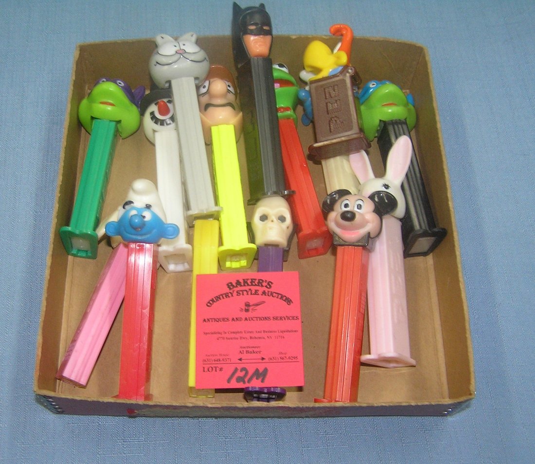 Box full of vintage PEZ candy containers: Box full of vintage PEZ candy containers est. value $75.00-$100.00