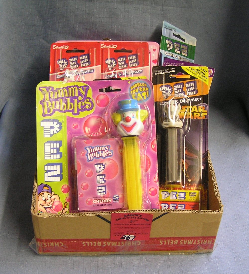 Box full of vintage PEZ candy containers: Box full of vintage PEZ candy containers est. value $100.00-$150.00