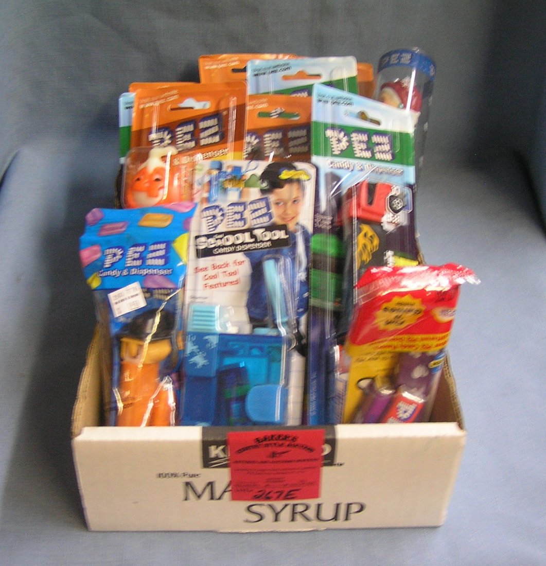 Box full of PEZ candy containers: Box full of vintage PEZ candy containers est. value $100.00-$125.00