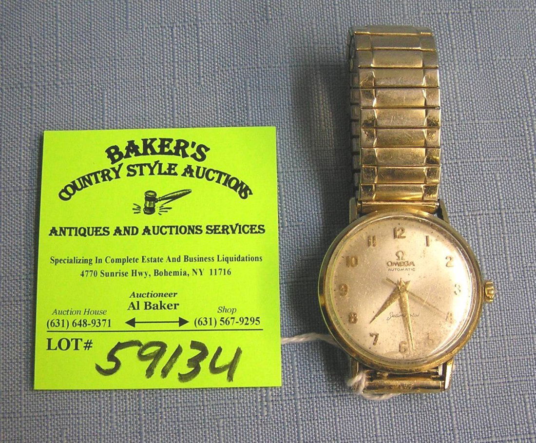 Early Omega Seamaster gentleman's wrist watch: Early Omega Seamaster automatic Swiss made gentleman's wrist watch, case appears to gold or gold filled, banned is marked Speidel USA, this circa 1950's watch is in excellent working condition est. va