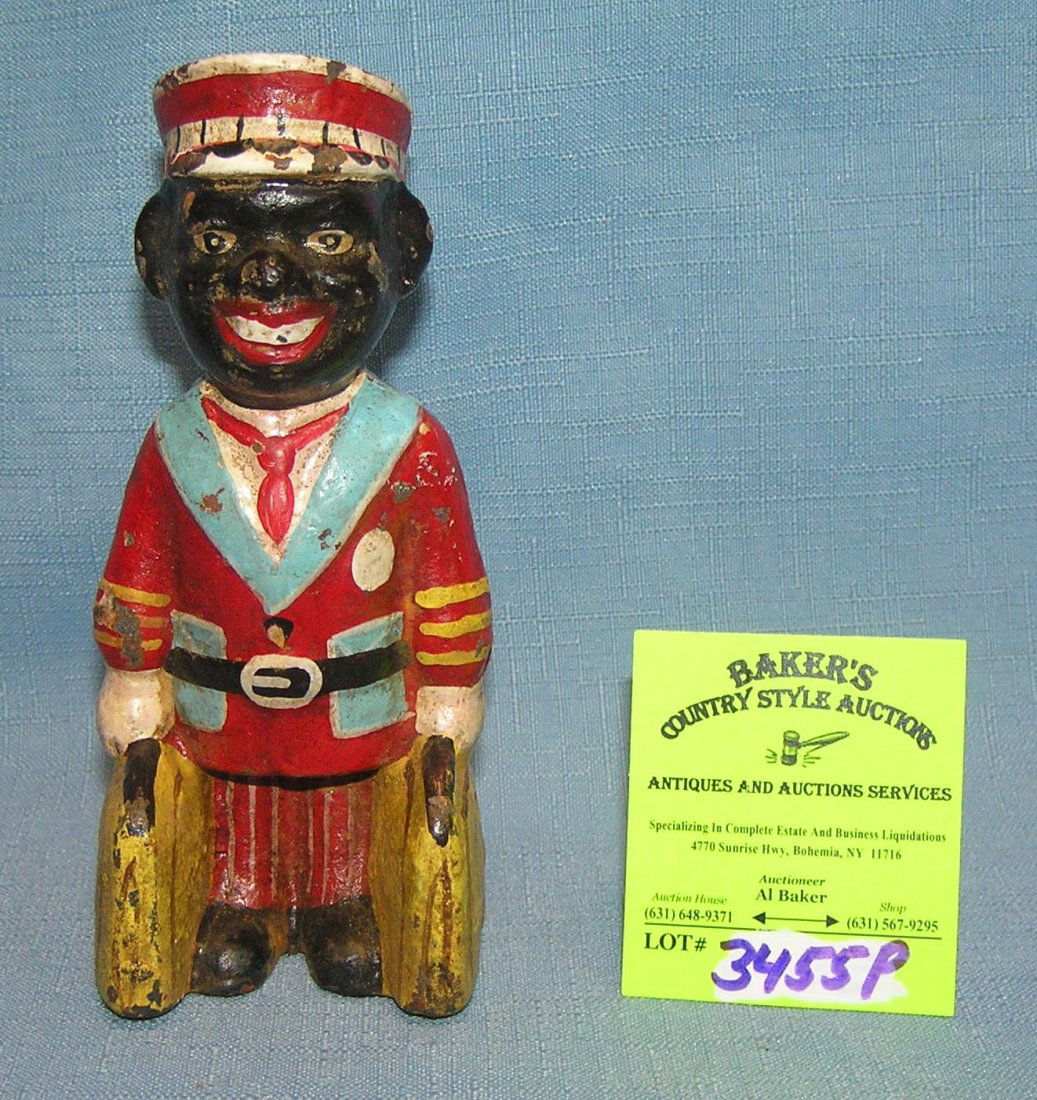 Hand painted cast iron black bell hop bank: Hand painted cast iron black bell hop bank est. value $65.00-$75.00