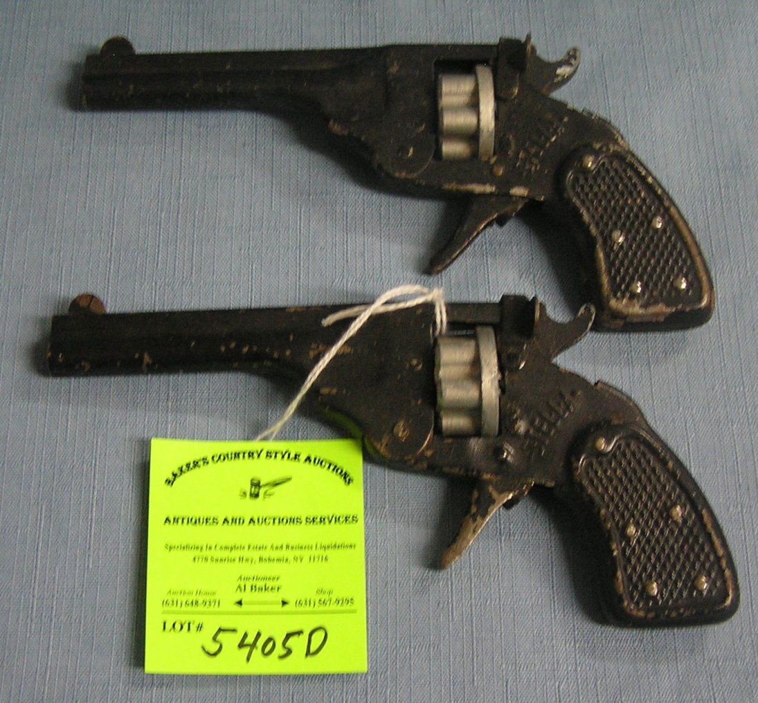 Pair of early Stella all metal cap guns: Pair of early Stella all metal cap guns $75.00-$100.00