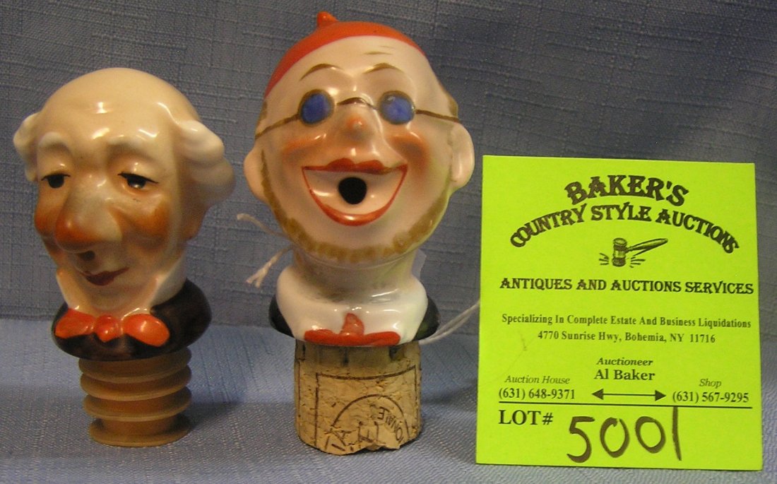 Pair of vintage porcelain liquor bottle stoppers: Pair of vintage hand painted porcelain liquor bottle stoppers $100.00-$125.00
