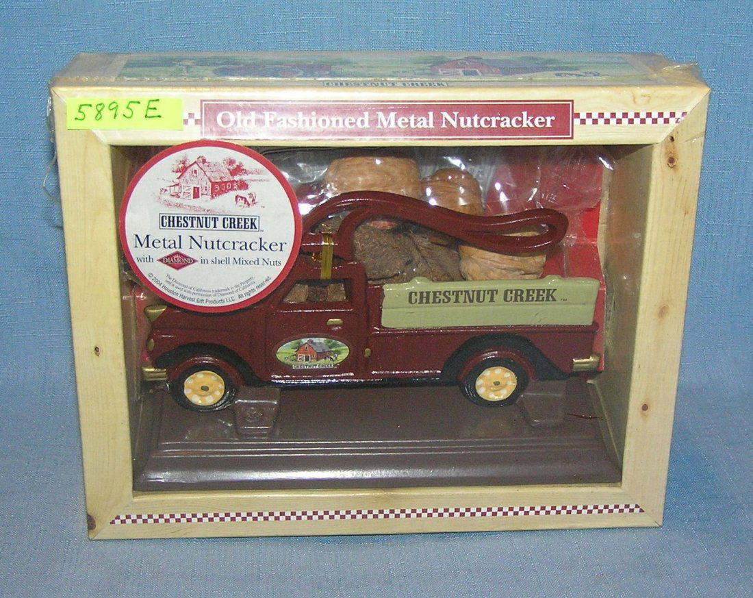 Cast iron limited edition nutcracker delivery truck: Old fashioned cast iron limited edition nutcracker delivery truck with Chestnut Creek advertising sealed in original box est. value $35.00-$40.00