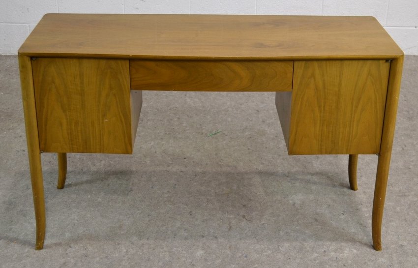 T.H. Robsjohn-Gibbings, WIDDICOMB Walnut Desk: Designed by T.H. Robsjohn - Gibbings Measuring 29" high by 48"wide by 18.5" deep. Table has surface scratch on top, pictured.