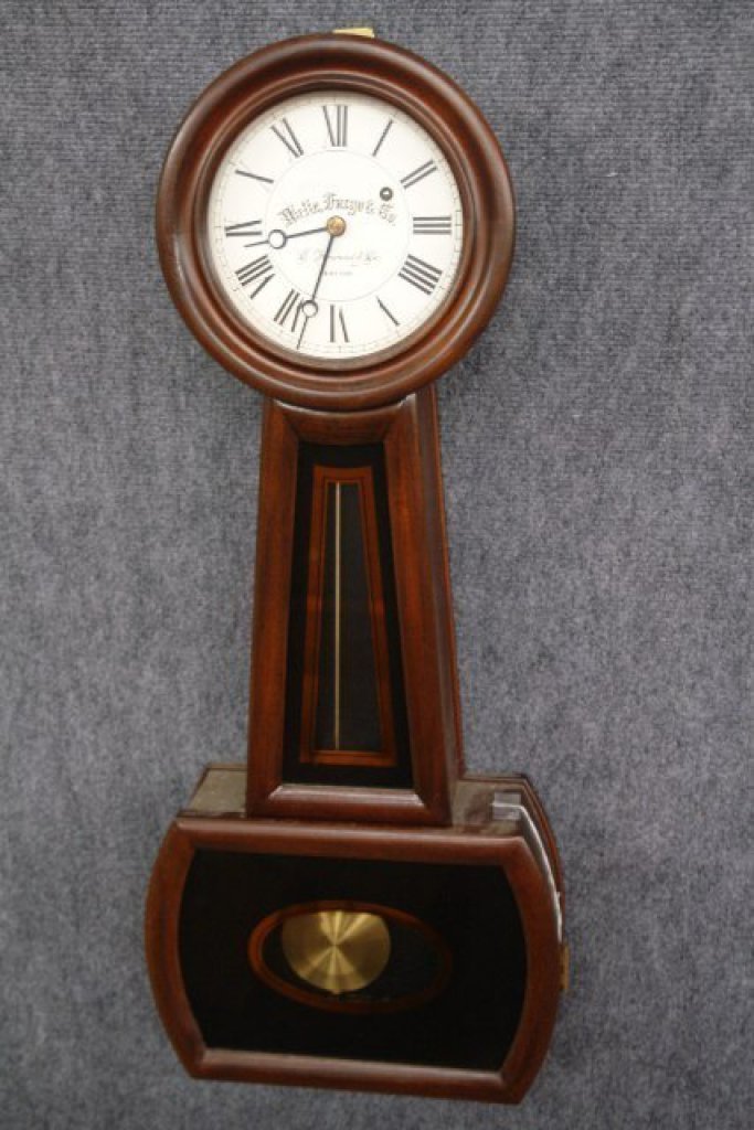 Wells Fargo & Co Banjo Wall Clock: Wells Fargo & Co Banjo Wall Clock, keywind, in mahogany case, pendulum and key - by E Howard & Co, Boston 30" tall, It has the key, the level, paperwork and the pendulum is on it.