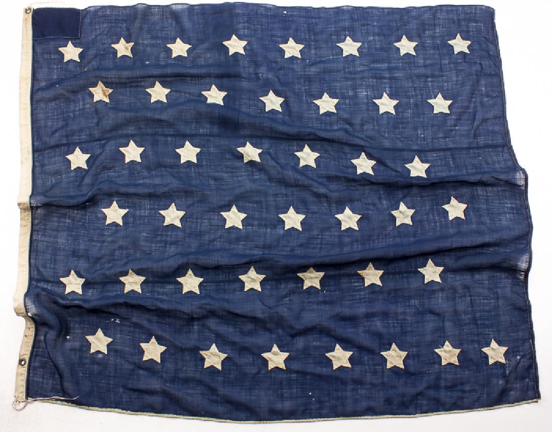 44-STAR U.S. NAVAL JACK: 44-STAR U.S. NAVAL JACK United States naval jack, 53 1/2" x 58", constructed of three pieces of blue wool bunting with 44 white bunting stars applied thereto, indicating that the flag was made and use