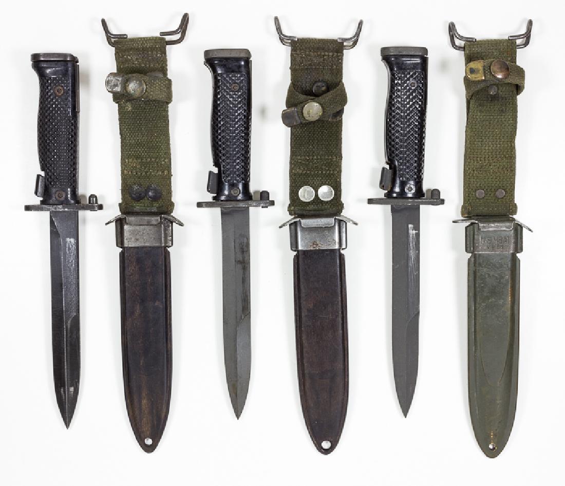 M1 GARAND BAYONETS: M1 GARAND BAYONETS Good lot of three M5A1 bayonets, for use with the U.S. M1 Garand rifle, all 6 1/2" blade, 11 1/4" blade, as marked as being manufactured by Imperial. All three are housed in M8A1 sc